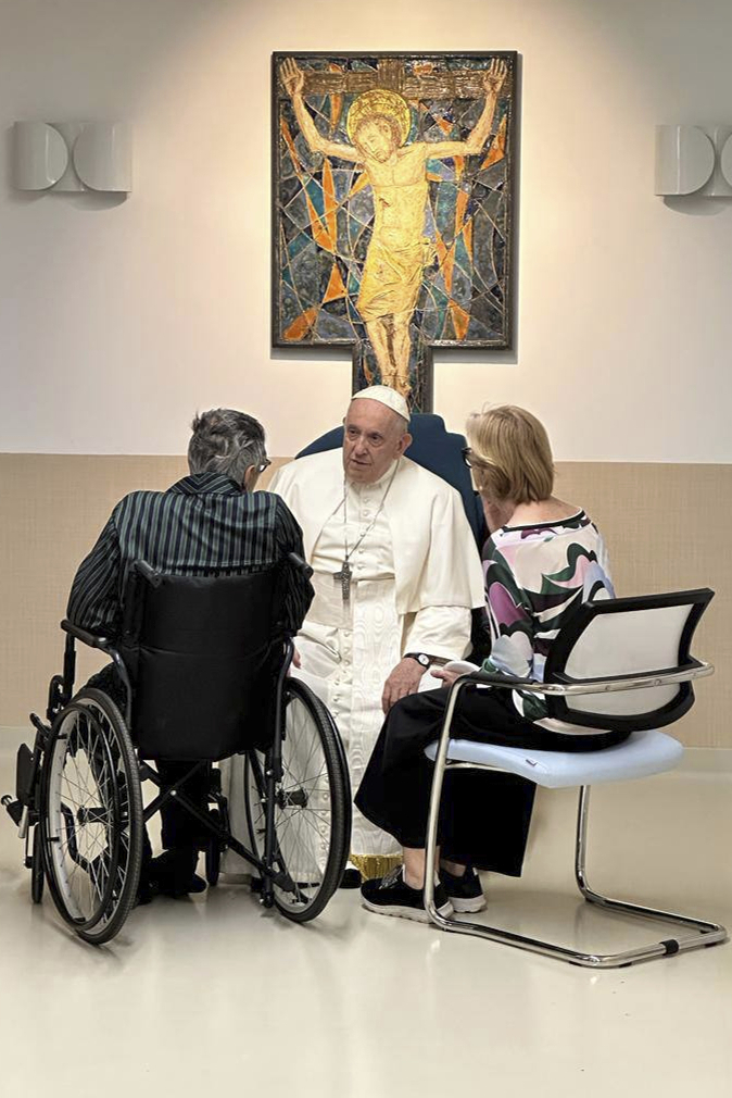 In this image distributed by Vatican Media, Pope Francis visits the Pediatric Oncology ward of the Agostino Gemelli University Polyclinic in Rome Thursday, June 15, 2023, where he's recovering from abdominal surgery since June 7. Francis, 86, underwent the operation to repair a hernia in the abdominal wall and to remove scar tissue that had formed following intestinal surgery in previous years. (Vatican Media via AP, ho)